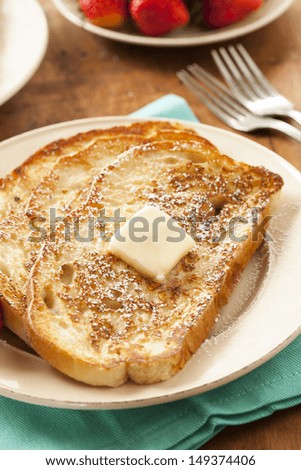Homemade French Toast with Butter and Powdered Sugar