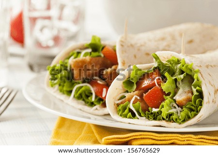 Breaded Chicken in a Tortilla Wrap with Lettuce and Tomato