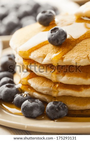 Homemade Buttermilk Pancakes with Blueberries and Syrup for Breakfast