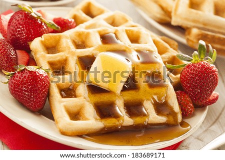 Homemade Belgian Waffles with Strawberries and Maple Syrup