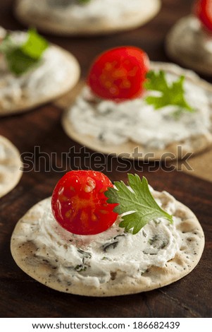 Cracker and Cheese Hors D\'oeuvres with Tomato and Parsley