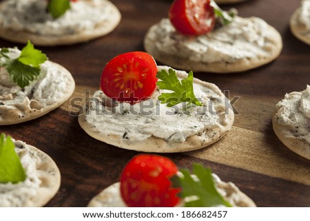 Cracker and Cheese Hors D\'oeuvres with Tomato and Parsley
