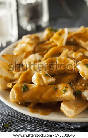 Unhealthy Delicious Poutine with French Fries and Gravy