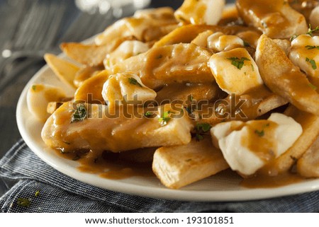 Unhealthy Delicious Poutine with French Fries and Gravy