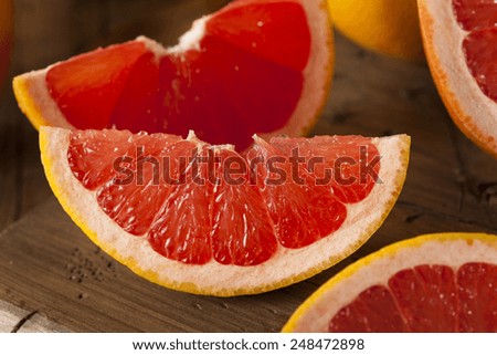 Healthy Organic Red Ruby Grapefruit on a Background