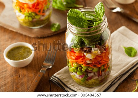 Healthy Homemade Mason Jar Salad with Egg Bacon Lettuce and Veggies