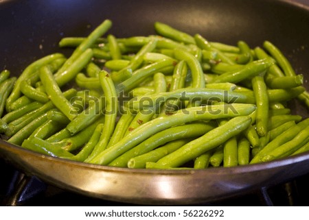 Green beans cooking in a skillet