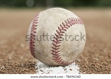 A baseball in on a baseball diamond