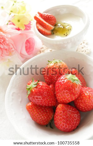 Freshness strawberry from Japan with dessert and flower on background