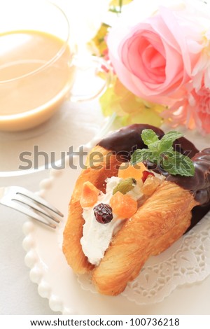 Dried fruit chocolate pie and milk tea for cafe food image