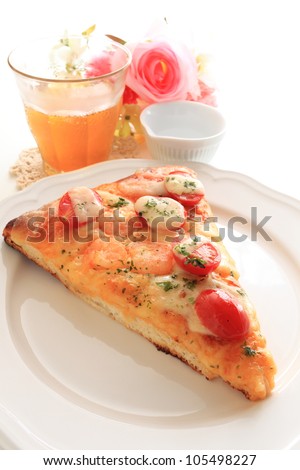 Homemade tomato and shrimp pizza and iced tea for cafe food image