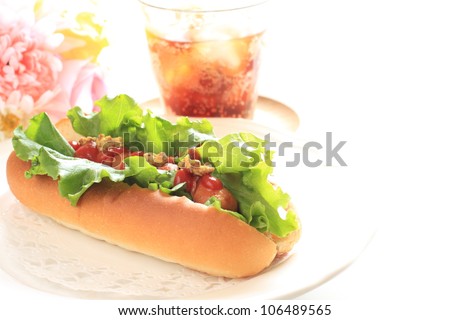 gourmet fast food, hot dog and cola with elegant flower for fast food image