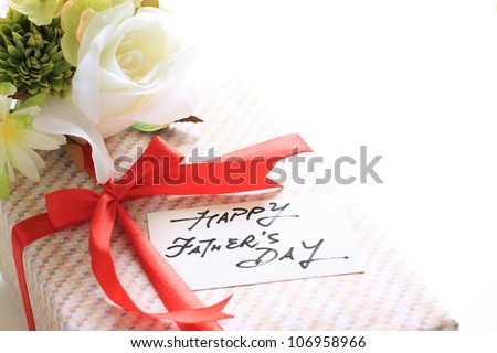 Present and flower on white background for Father's day image with copy space