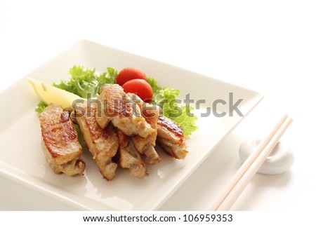 Asian food, tasty grilled chicken wing with freshness vegetable on side