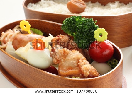 Japanese cuisine homemade packed lunch, fried chicken and vegetable