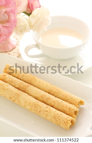 Asian confectionery, egg roll on dish with Royal milk tea