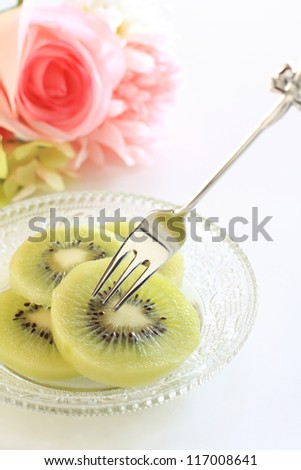 freshness cut fruit, kiwi fruit on glass dish with fork