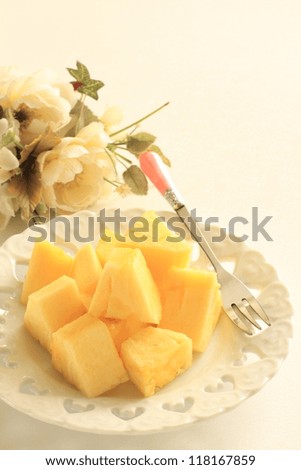 tropical fruit, cut pineapple on white dish for gourmet dessert image