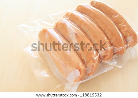 Proceeded food, pork sausage in plastic pack with flower