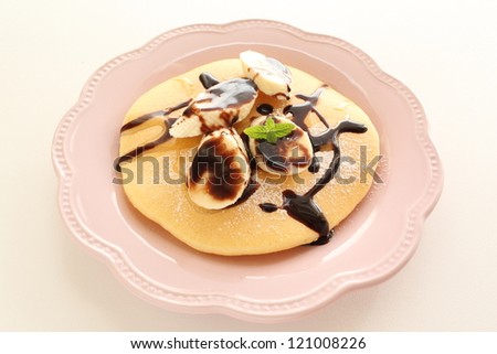 freshness sliced banana and chocolate sauce on pancake for elegance breakfast image