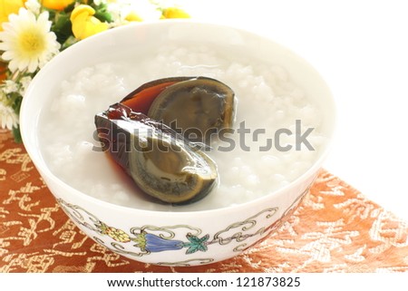 chinese food, preserved duck egg Thousand year egg on congee for breakfast image