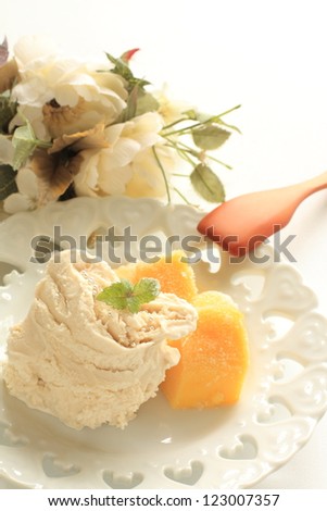 Caramel ice cream and frozen Mango for gourmet dessert image