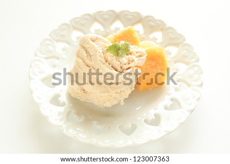 Caramel ice cream and frozen Mango for gourmet dessert image