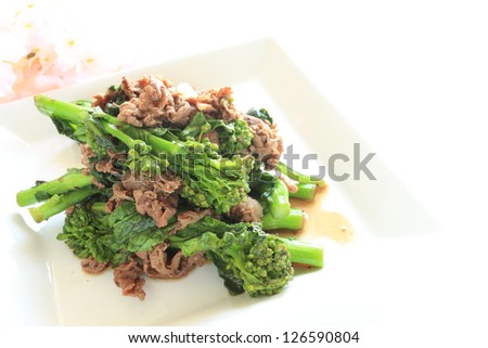 chinese cuisine, rape blossom and beef stir fried for spring food image
