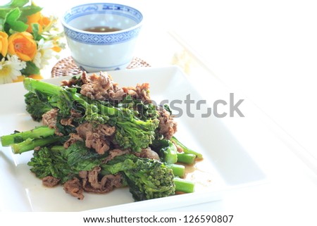 chinese cuisine, rape blossom and beef stir fried for spring food image