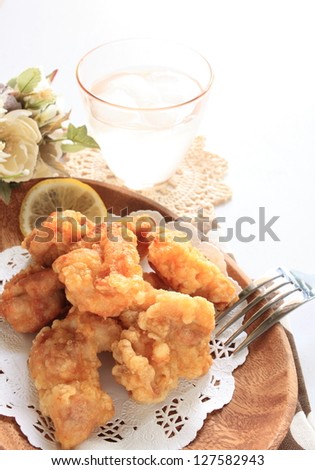 japanese cuisine, fried chicken on wooden plate with drink