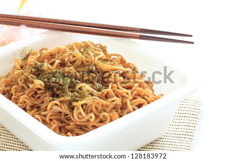 Japanese instant noodle, sauce fried noodle with flower on background