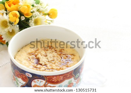chinese cuisine, mince chicken in steamed egg with soy sauce on top