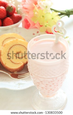 gourmet honey roll cake and strawberry milk for spring food image