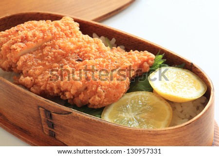 japanese cuisine, fried chicken with lemon on rice packed lunch