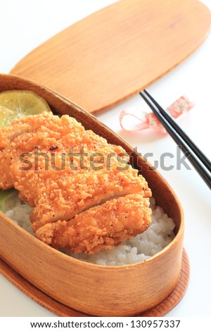 japanese cuisine, fried chicken with lemon on rice packed lunch