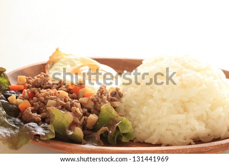 thai cuisine, spicy mince pork and vegetable with sunny side up Rice