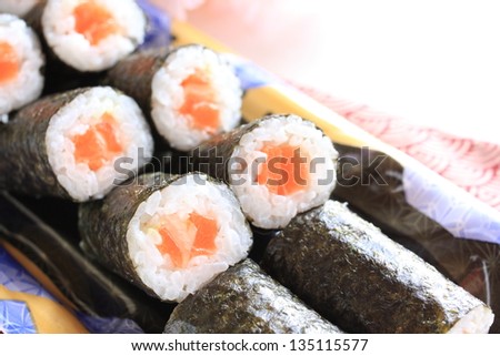 japanese cuisine, salmon sushi roll on food container for lunch pack image