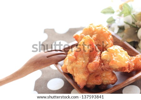 Japanese food, fried chicken on wooden plate with copy space for gourmet food image