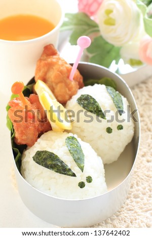japanese food, cutie rabbit rice ball packed lunch Kyaraben with orange juice for picnic food image