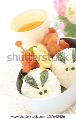 japanese food, cutie rabbit rice ball packed lunch Kyaraben with orange juice for picnic food image