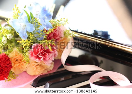 elegant flower bouquet on piano keyboard