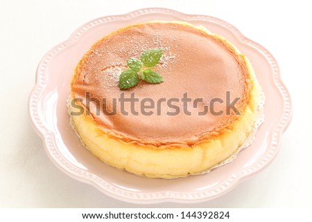 home bakery cheese cake with mint on top for gourmet dessert image