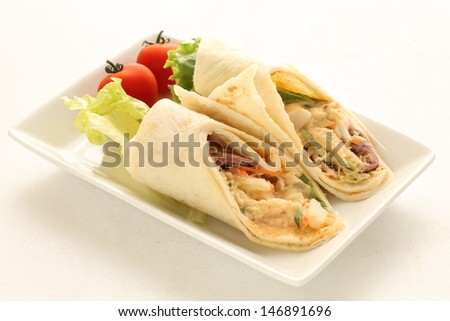 spanish food, vegetable and roasted beef tortilla roll