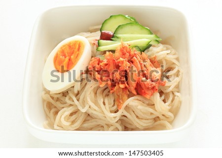 Gourmet Korean cuisine,  cold noodles with egg and Kimichi on top for gourmet lunch menu