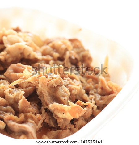 Japanese food, gyudon simmered beef and onion on rice in plactic container for lunch pack image