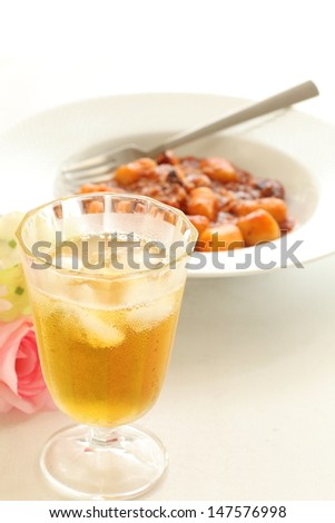 glass of iced tea with italian food gnocchi on background for gourmet cafe food image