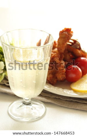 lemon and soda for alcohol drink image with fried chicken on background