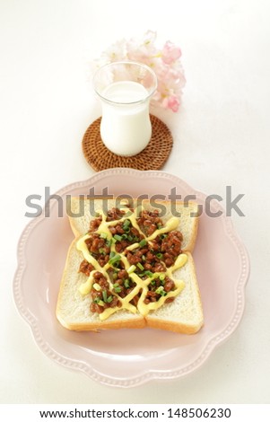 Japanese fusion food, Natto and mayonnaise on toast with milk on back