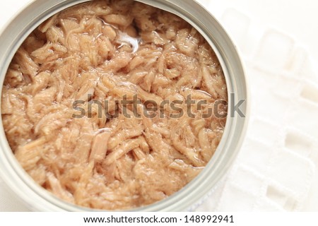 Can food, tuna fish flake close up on white background with copy space