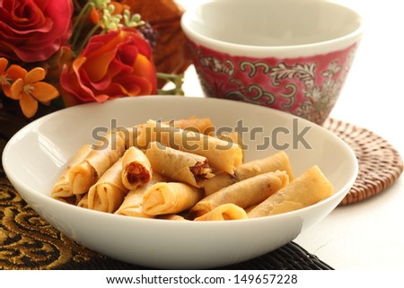 East Asian snack food, Chili prawn rolls on white dish white with Chinese tea